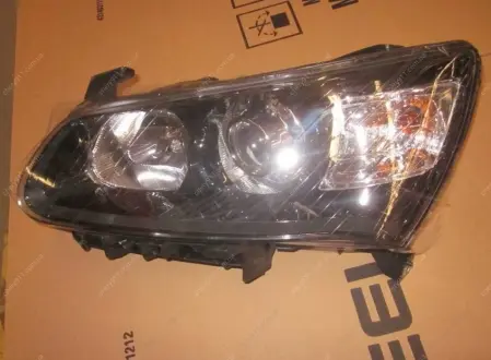 Фара передня L EC7RV (black) GEELY 1067004427